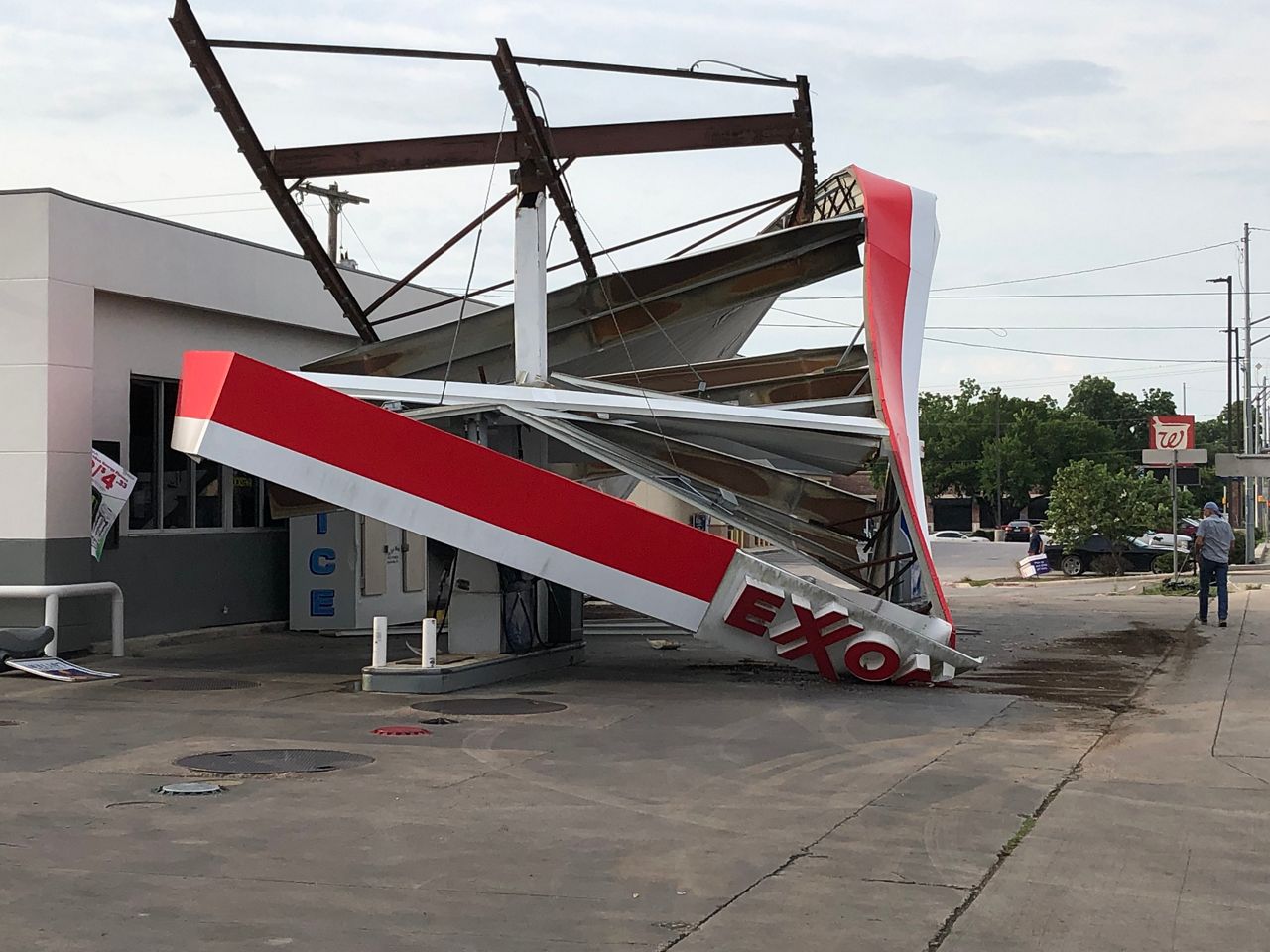 The roof of an Exxon Gas Station was destroyed by strong winds in Lockhart, Texas on Sunday. 