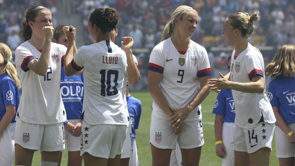 The United States women's national team walks out onto the pitch before the first half of an international friendly soccer match against Mexico, Sunday, May 26, 2019, in Harrison, N.J. The U.S. won 3-0. (AP Photo/Steve Luciano)