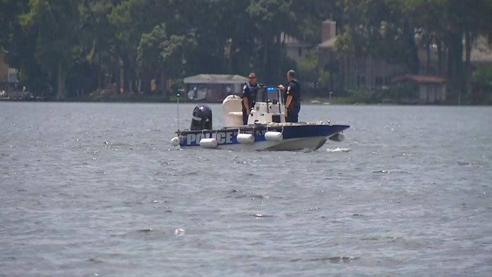 Police, fire crews, and a dive team search Lake Maitland on Wednesday after receiving reports of a plane down in the lake. (Mike Wash/Spectrum News 13)