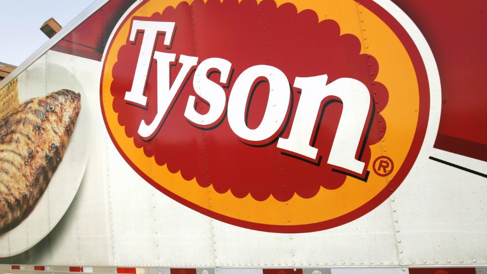 FILE- In this Wednesday, Oct. 28, 2009, file photo, a Tyson Foods, Inc., truck is parked at a food warehouse in Little Rock, Ark.