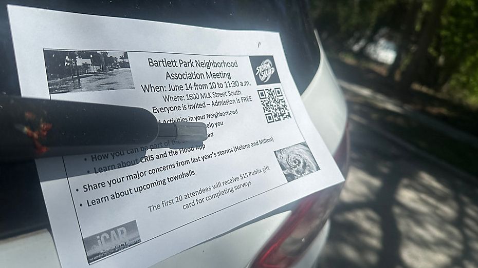 A flyer on Saturday's Storm Squad meeting sits on a windshield wiper in the Bartlett Park neighborhood. (Spectrum News)