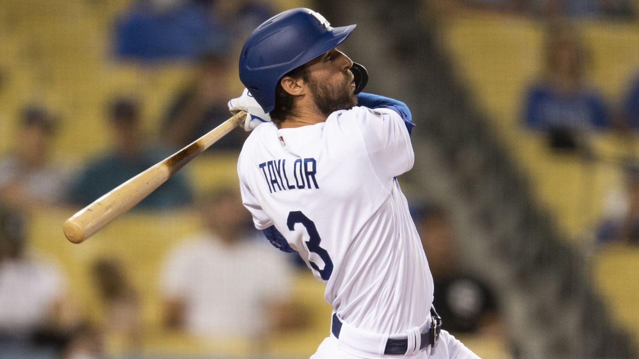 Los Angeles Dodgers' Chris Taylor watches his solo home run during the fifth inning of a baseball game against the Philadelphia Phillies in Los Angeles, Monday, June 14, 2021. (AP Photo/Kyusung Gong)