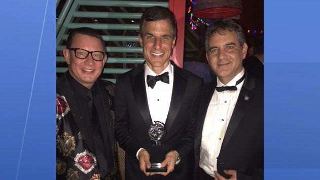 Dr. Jeffrey Grove (left) stands with fellow producers with their Tony Award for Best Revival of a Musical. 