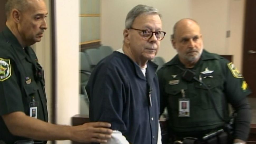 Former Isleworth millionaire Bob Ward is led into an Orange County courtroom on Thursday during his sentencing for his 2nd conviction in the death of his wife, Diane. (Spectrum News 13)