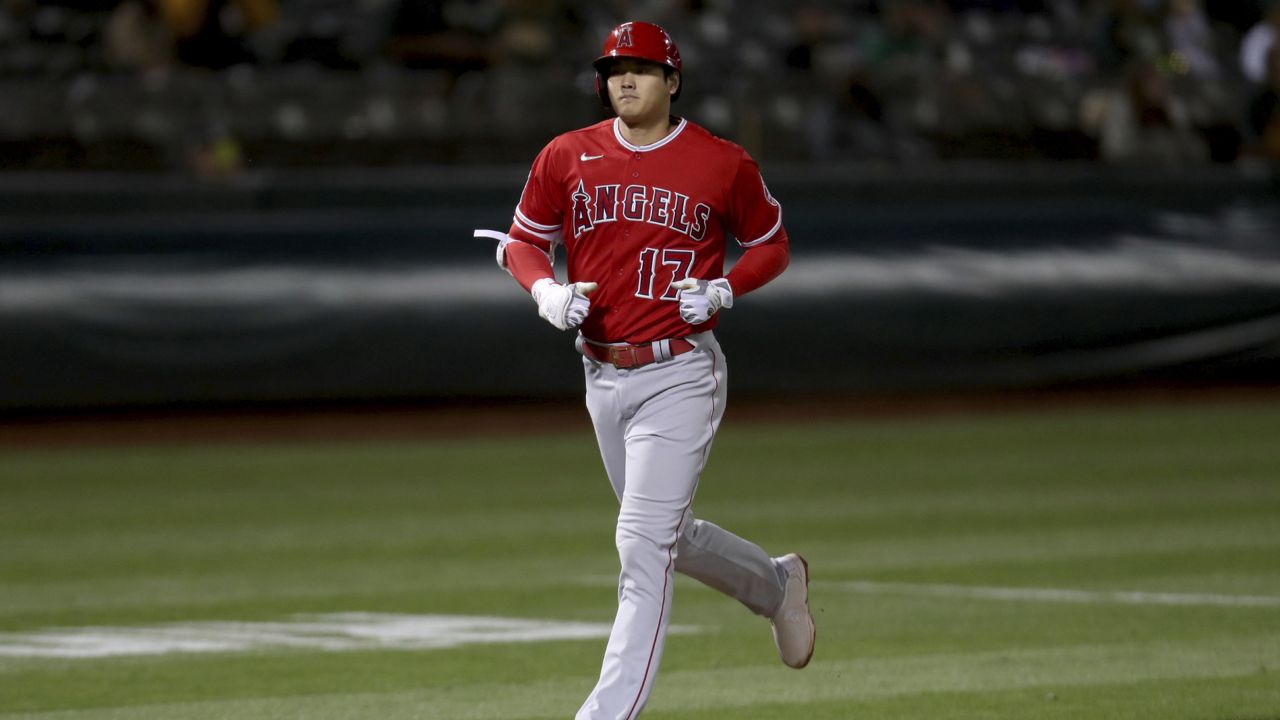 Los Angeles Angels' Shohei Ohtani runs the bases after hitting a solo home run against the Oakland Athletics during the eighth inning of a baseball game in Oakland, Calif., Tuesday, June 15, 2021. (AP Photo/Jed Jacobsohn)