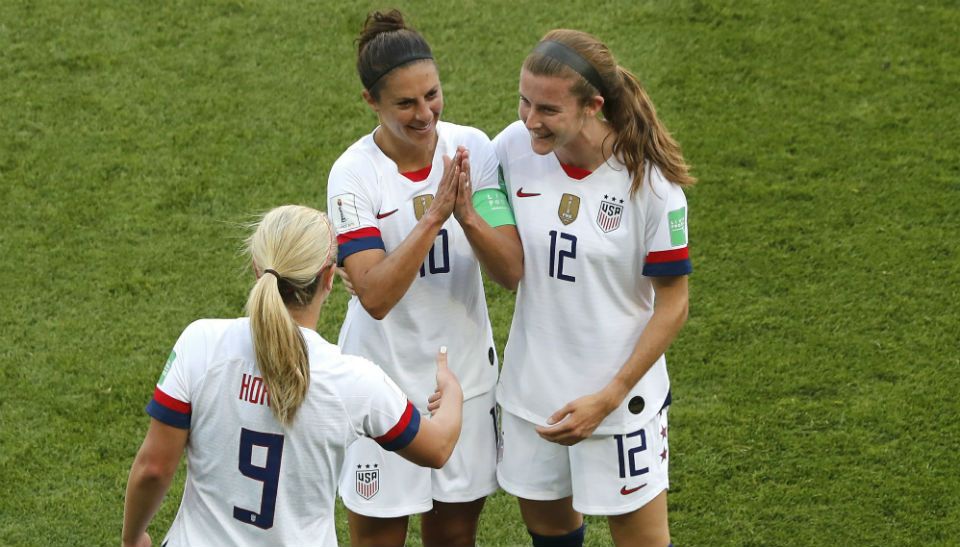 United States' Carli Lloyd , center, celebrates with Lindsey Horan and Tierna Davidson, right, after scoring the opening goal during the Women's World Cup Group F soccer match between the United States and Chile at the Parc des Princes in Paris, Sunday, June 16, 2019. (AP Photo/Thibault Camus)
