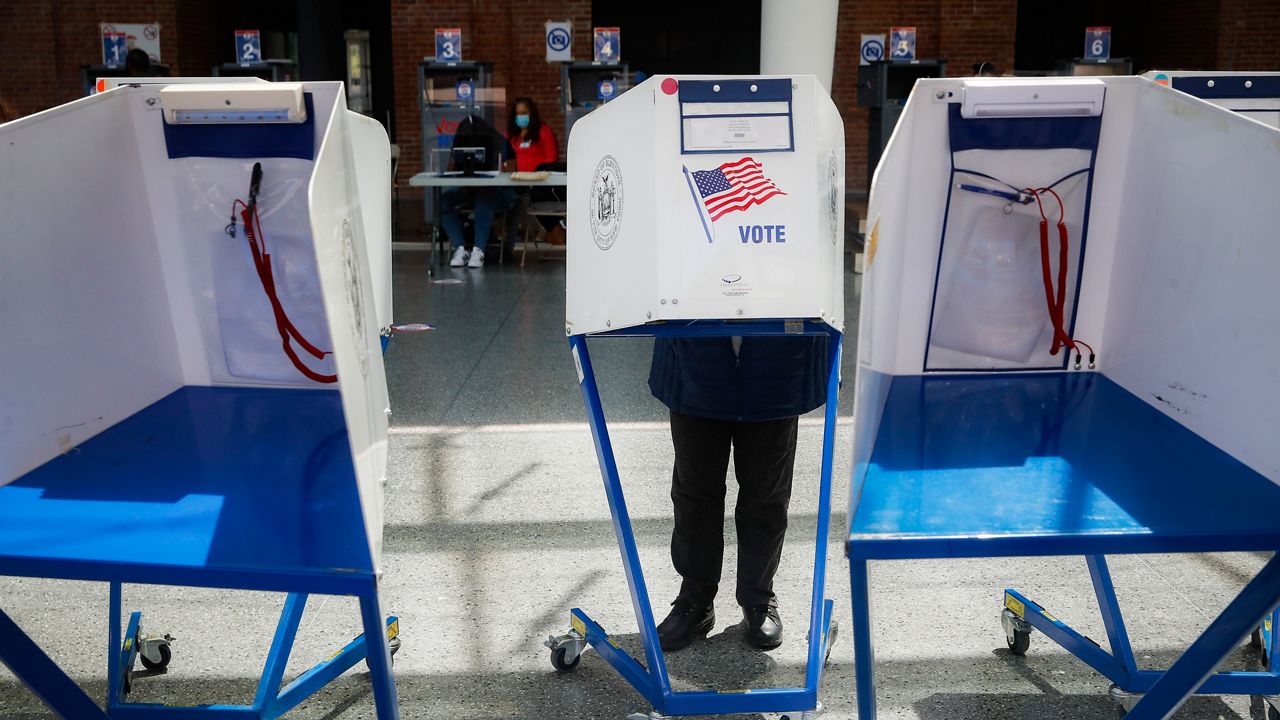 Voting booth. (AP photo)
