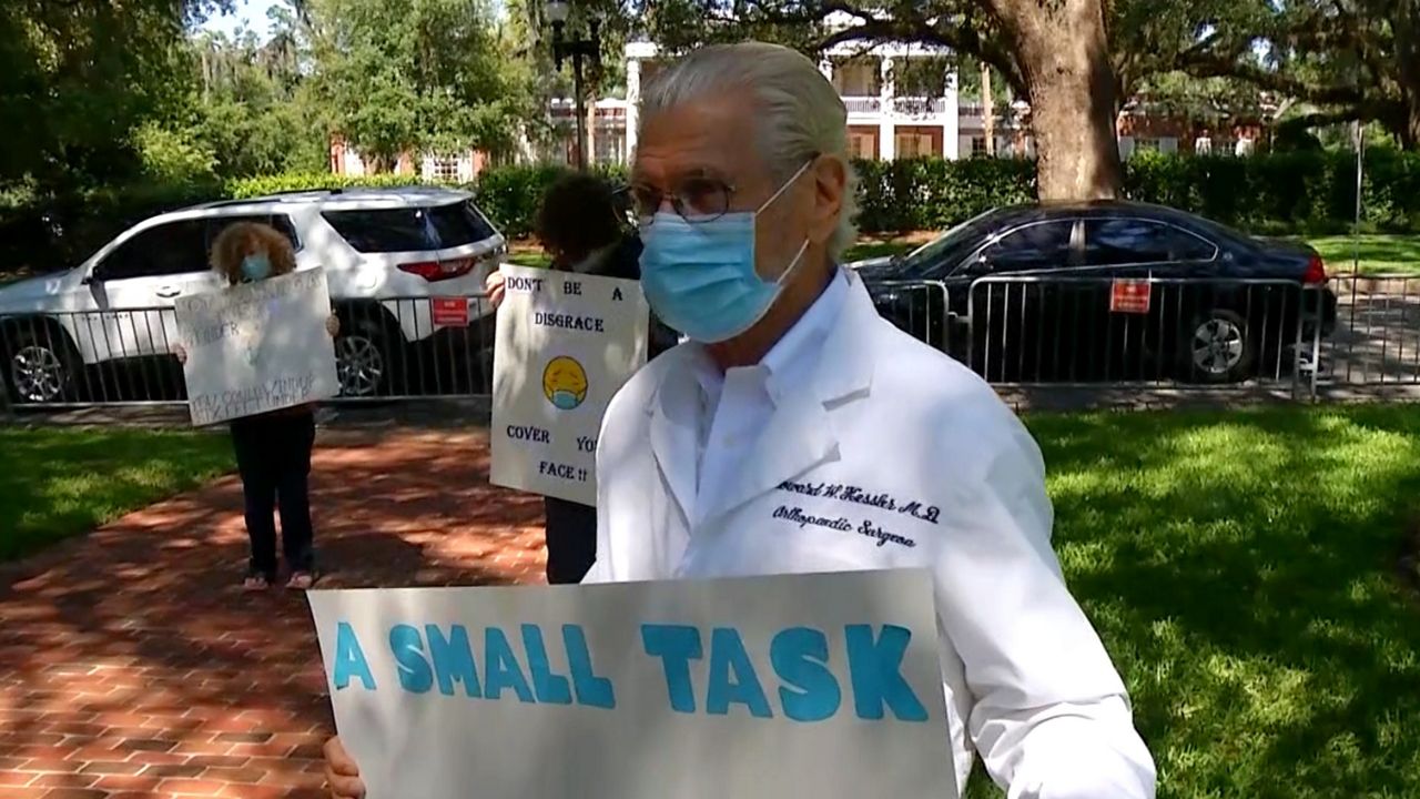 One of several doctors protesting outside the Governor's Mansion in Tallahassee, calling on Gov. Ron DeSantis to pass a law mandating wearing masks in public enclosed spaces to prevent community spread of the coronavirus. 