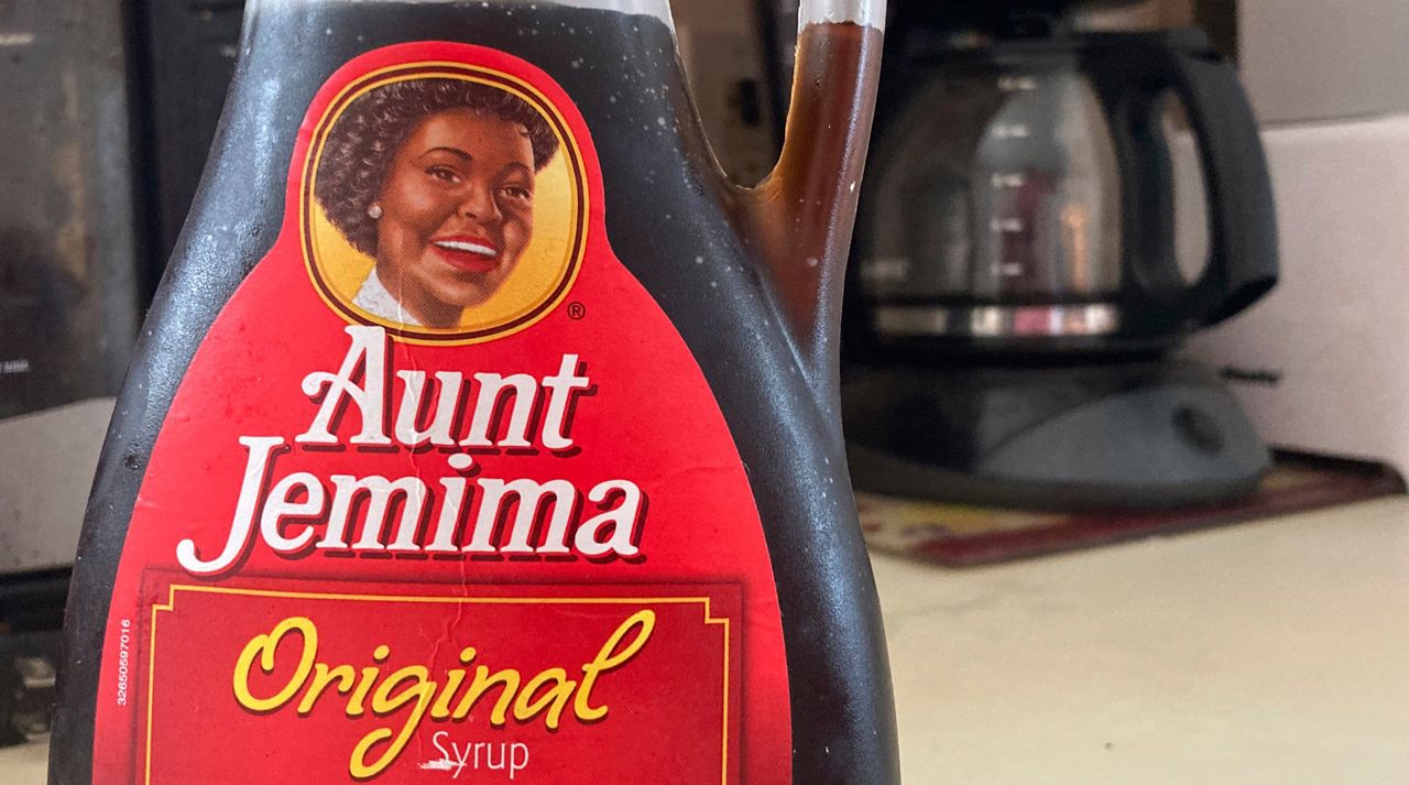 A bottle of Aunt Jemima syrup sits on a counter, Wednesday, June 17, 2020 in White Plains, N.Y. Pepsico is changing the name and marketing image of its Aunt Jemima pancake mix and syrup, according to media reports. A spokeswoman for Pepsico-owned Quaker Oats Company told AdWeek that it recognized Aunt Jemimaâ€™s origins are based on a racial stereotype and that the 131-year-old name and image would be replaced on products and advertising by the fourth quarter of 2020. (AP Photo/Donald King)