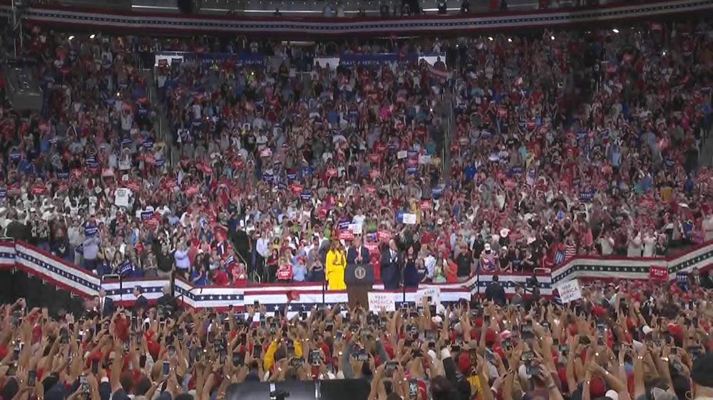 President Donald Trump and first lady Melania Trump join Vice President Mike Pence and second lady Karen Pence on stage at the Amway Center in Orlando during a re-election rally. (Spectrum News)