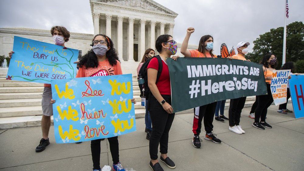 Immigrants rights advocates rally outside the US Supreme Court