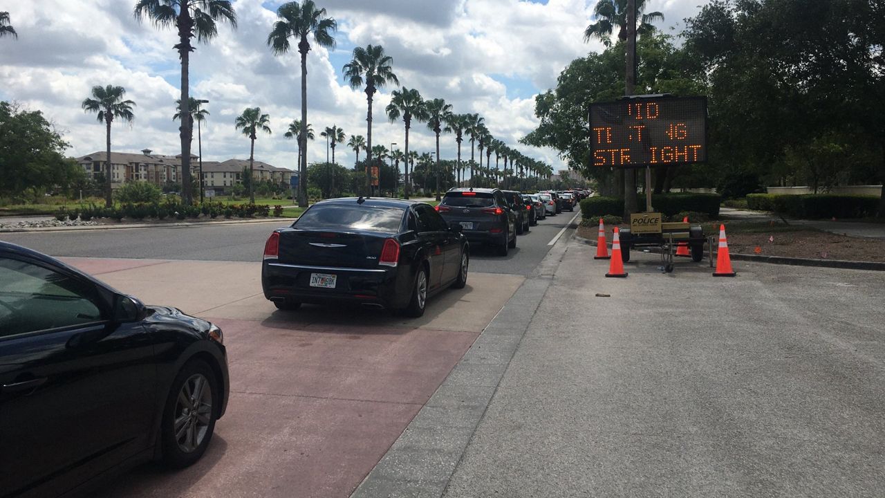 Long lines for testing at the regional drive-thru site at the Orange County Convention Center in Orlando. (Matt Fernandez, Spectrum News)