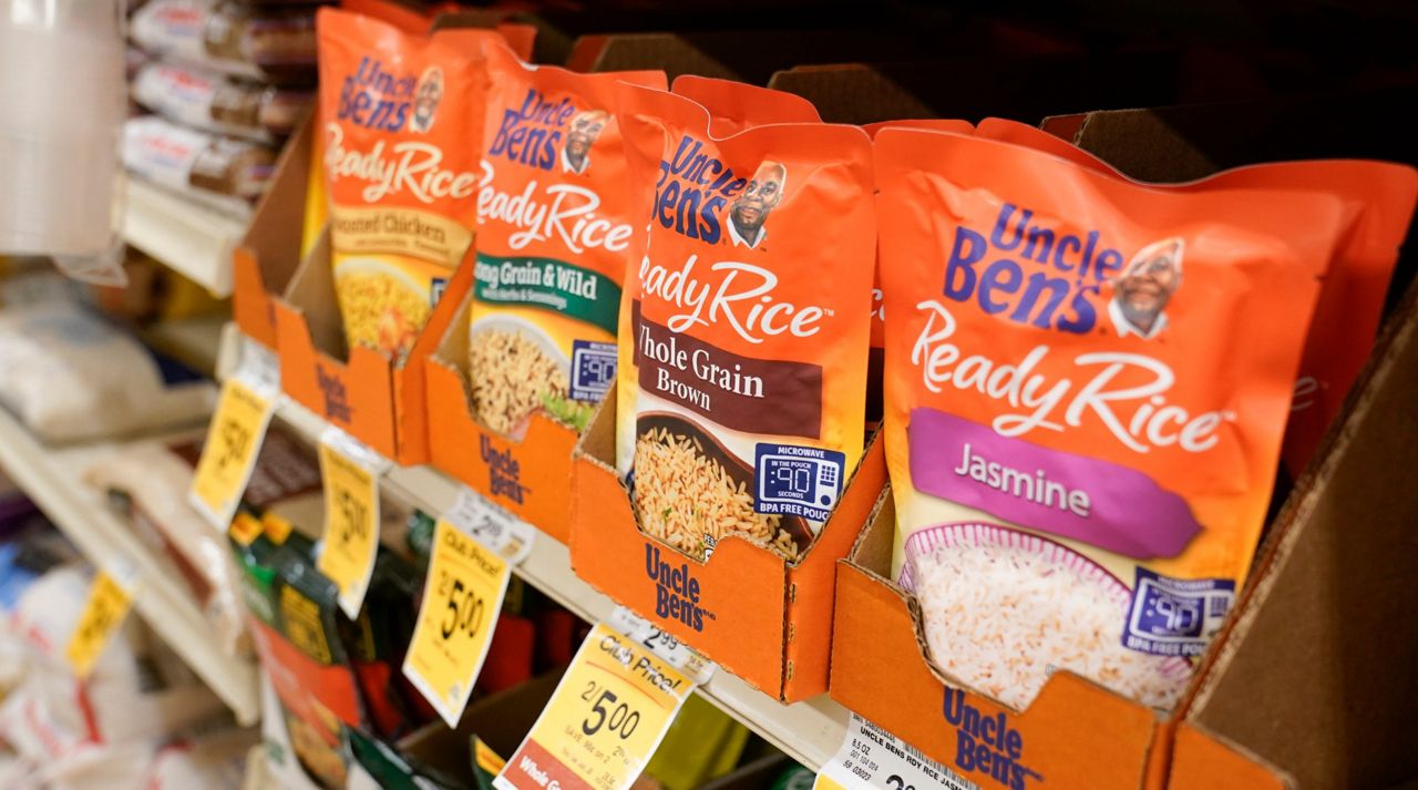 Packages of Uncle Ben's Ready Rice are displayed on a grocery store shelf on Wednesday, June 17, 2020, in Long Beach, Calif. (AP Photo/Ashley Landis)