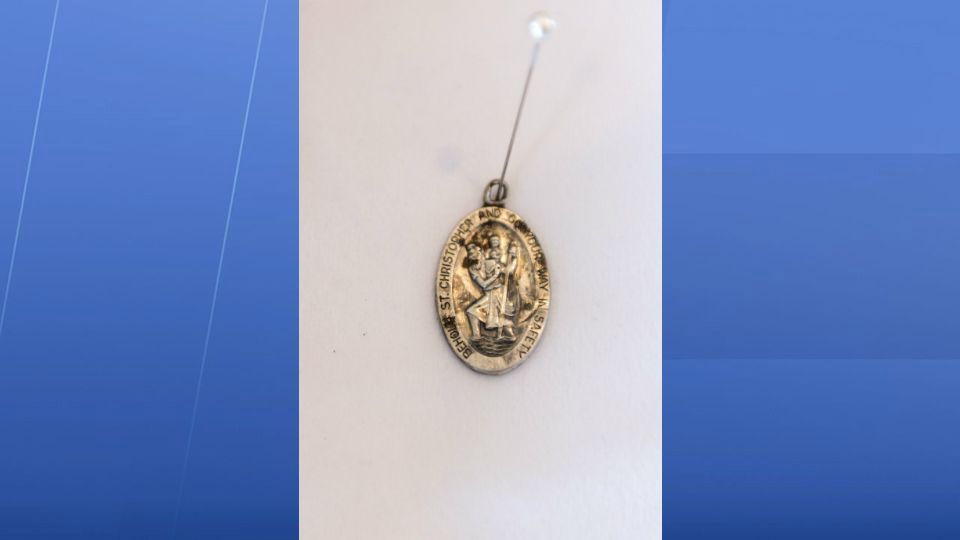Stewart's St. Christopher medal was found where he had been buried near the crash site. It was on display in the lobby of the church during the funeral. 