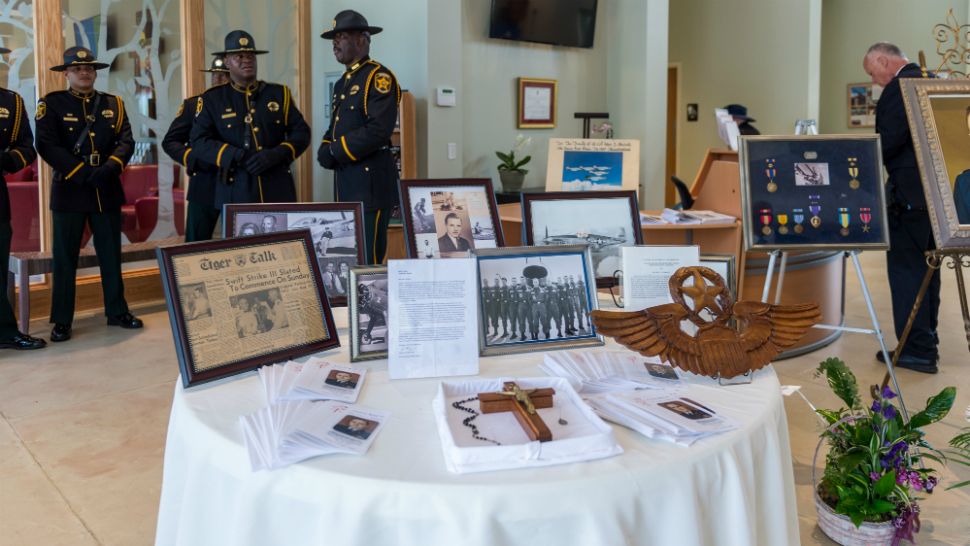 Photos of Col. Peter Stewart were on display during Monday's service in Winter Haven. (Spectrum News Staff)