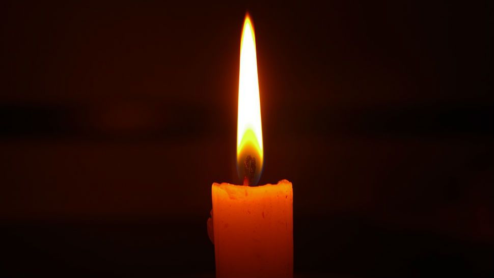 FILE photo of a candle in the dark. 