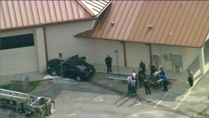 A car crashed into the Washington Shores Church of Christ Wednesday. The vehicle had been carjacked, according to Orlando police. (Sky 13)
