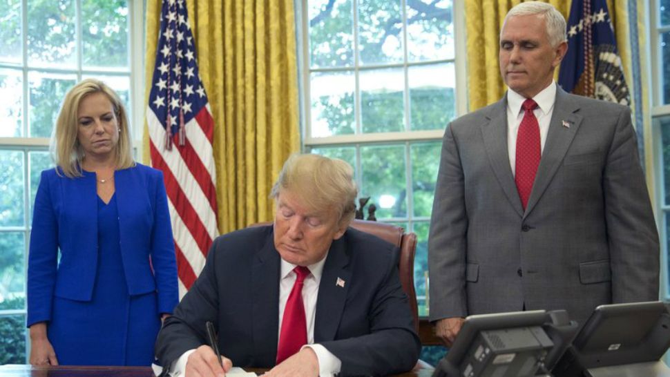 Homeland Security Secretary Kirstjen Nielsen, left, is seen in the Oval Office on Wednesday. (AP Photo/Pablo Martinez Monsivais)