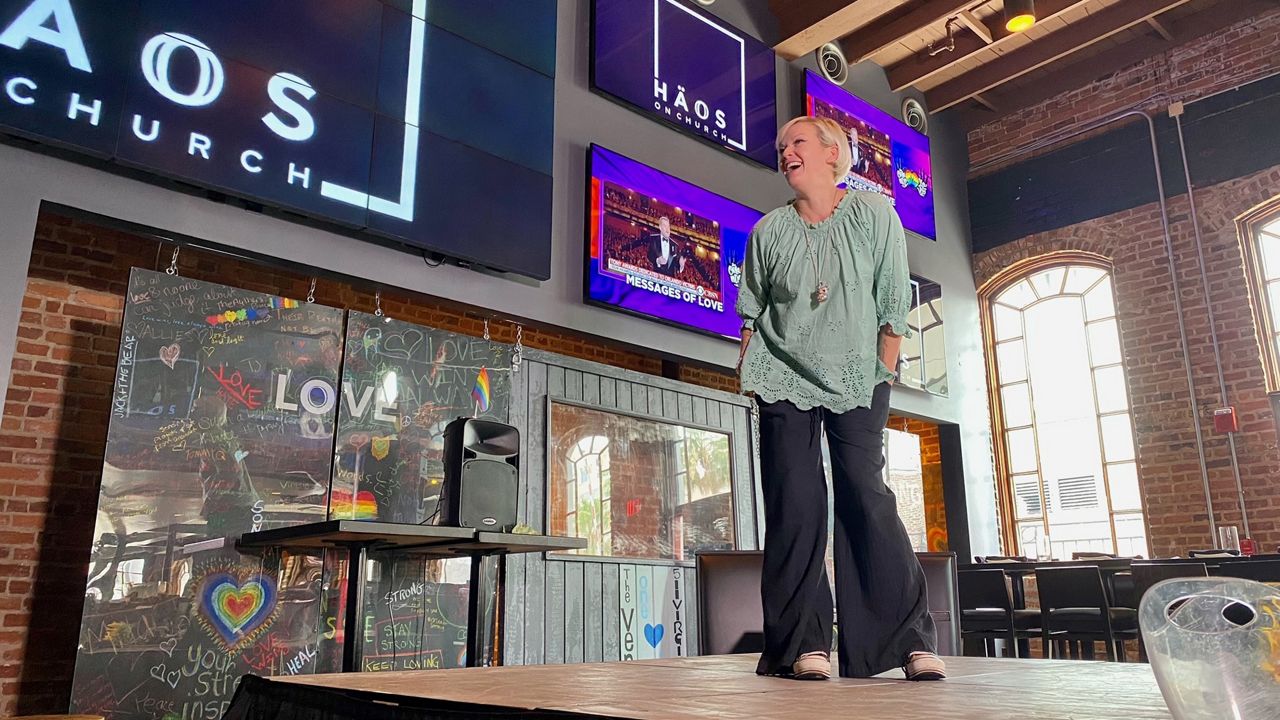 Blue Star stands on HAOS “four corners” stage, located in the center of the two-story bar and restaurant. (Spectrum News/Julie Gargotta)