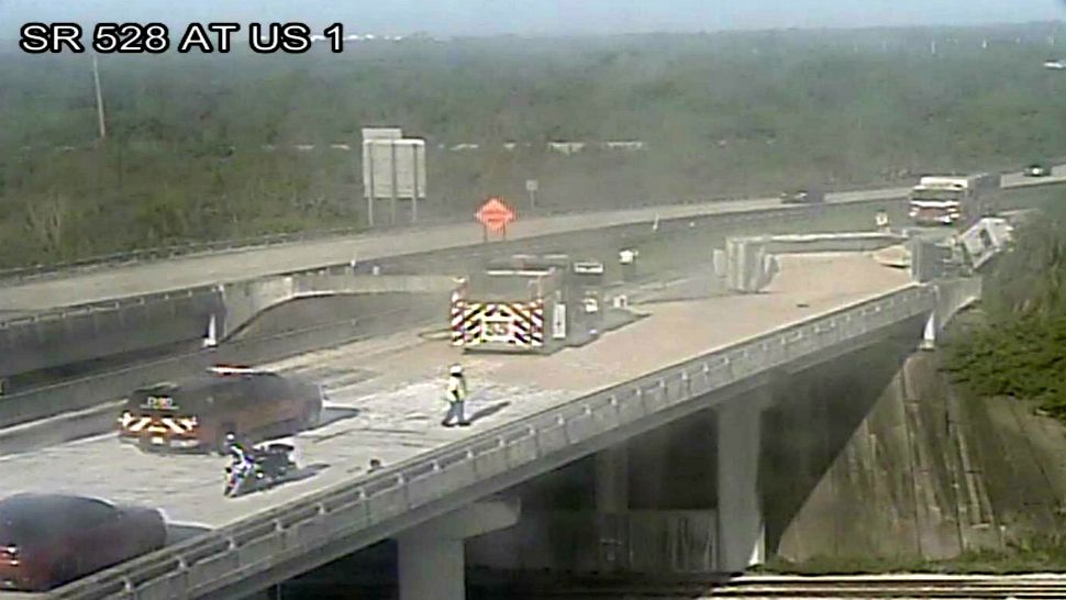 A semi hauling rocks and sand overturned Friday morning on State Road 528 at U.S. 1 in Titusville, blocking the westbound lanes. (Florida Department of Transportation camera)