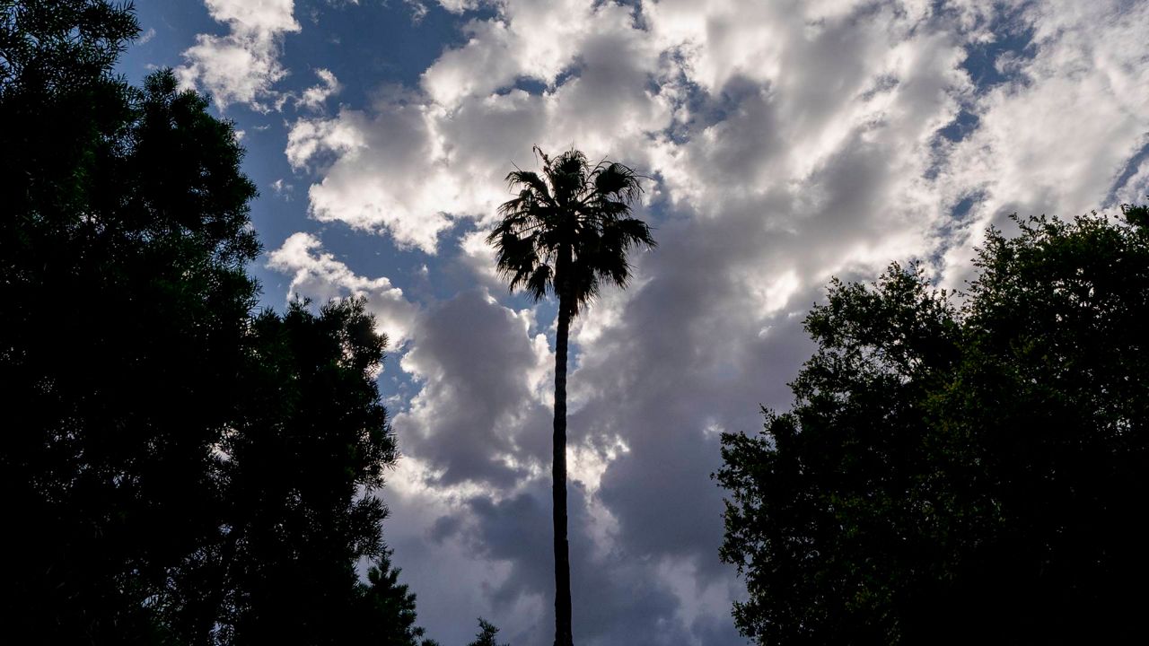Cloud formations move over downtown Los Angeles on Wednesday. (AP Photo/Damian Dovarganes)