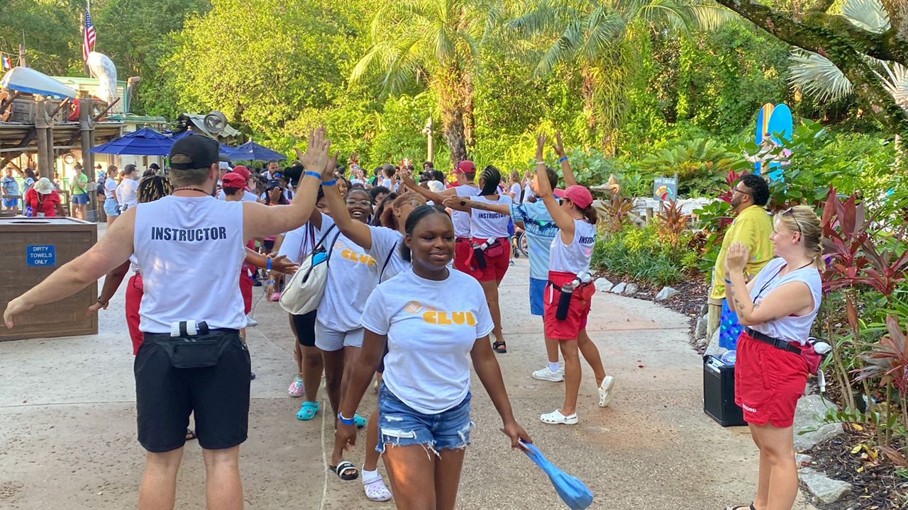 Children from the Central Florida community participate in the World's Largest Swimming Lesson event at Disney's Typhoon Lagoon. (Spectrum News/Ashley Carter)