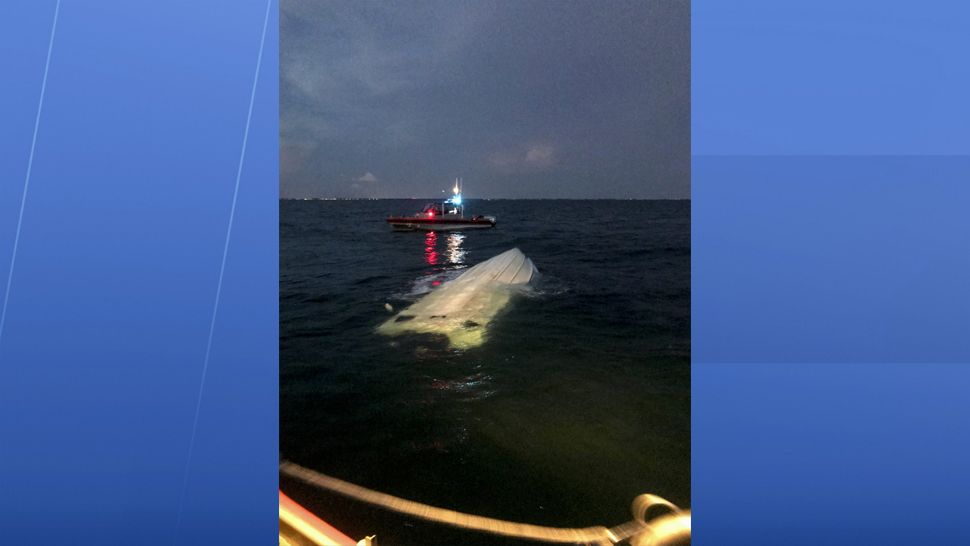 The Coast Guard rescued two boaters Thursday after their vessel capsized about six miles west of Longboat Key. (Coast Guard)