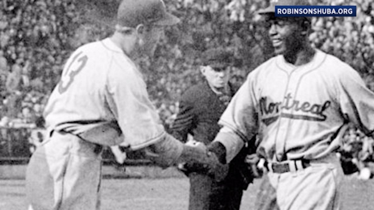 Iconic Robinson-Shuba Handshake Cemented in Time