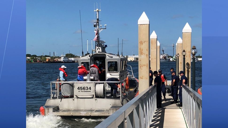 The Coast Guard, with the help of a good Samaritan, rescued three boaters Saturday after their boat capsized 12 miles west of Tampa. (Coast Guard St. Pete)