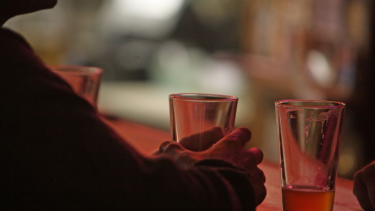 Silhouette of person at bar. (File)