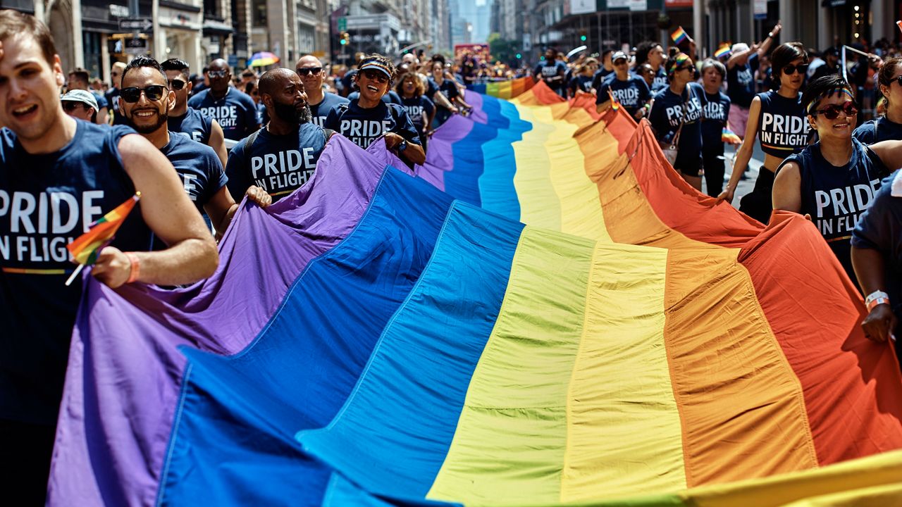 A rainbow-colored LGBTQ flag along Fifth Avenue during the New York City Pride March in June 2018