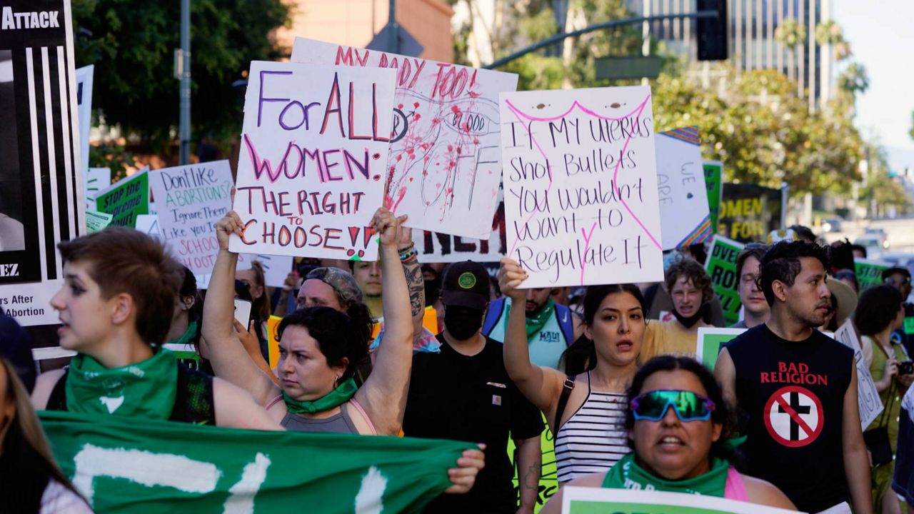 Supporters of abortion rights hold a rally outside the First Street U.S. Courthouse, Central District of California, in downtown Los Angeles, June 25, 2022. (AP Photo/Damian Dovarganes)