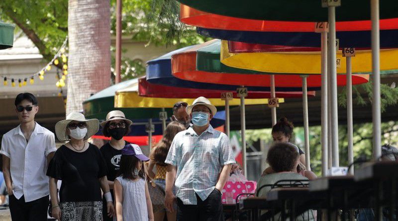 Visitors, some wearing masks to protect against the spread of COVID-19, walk along the River Walk in San Antonio, Wednesday, June 24, 2020, in San Antonio. Cases of COVID-19 have spiked in Texas and the governor of Texas is encouraging people to wear masks in public and stay home if possible. (AP Photo/Eric Gay)