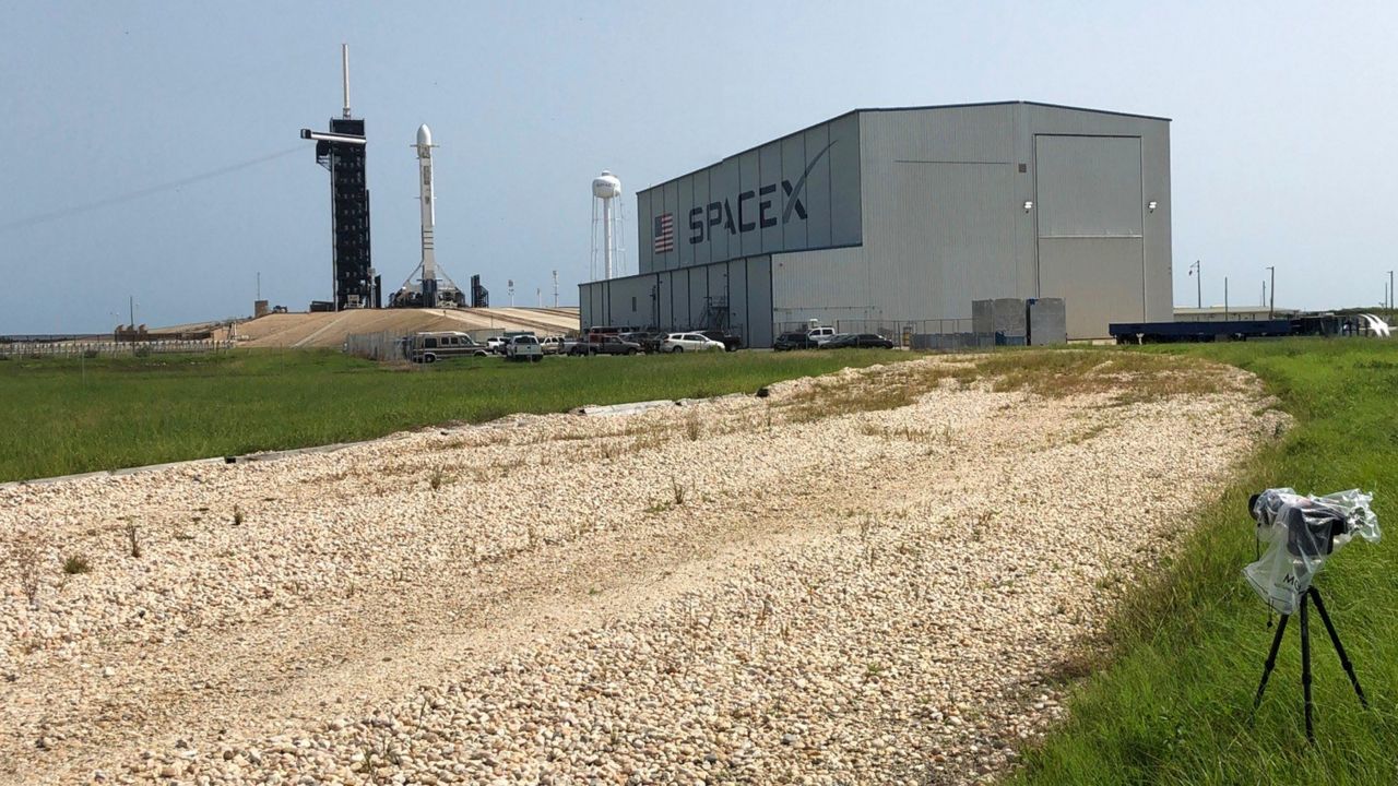 A SpaceX Falcon 9 rocket sits on launch pad 39A at Kennedy Space Center on Friday morning. The launch attempt was postponed hours before launch time by SpaceX, which said it needed more time for "pre-launch checks." (Jonathan Shaban/Spectrum News)