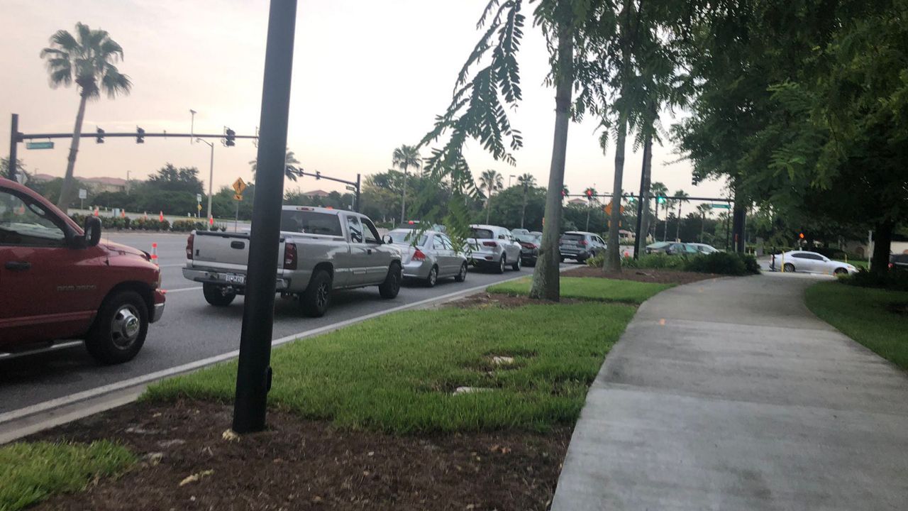 For more than a week, there have been long car lines and increasing wait times as hundreds of people came out to be tested at the Orange County Convention Center. Organizers are expecting another buys weekend. (Rachael Krause/Spectrum News 13)