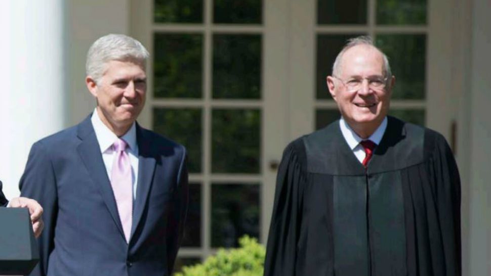 In this file photo from Monday, April 10, 2017, Justice Anthony M. Kennedy (right) stands next to Associate Justice Neil M. Gorsuch in the White House Rose Garden after Kennedy administered the Judicial Oath to Gorsuch, who is the 1st justice to serve as a member of the Supreme Court alongside a justice for whom he clerked. (Franz Jantzen, Collection of the Supreme Court of the U.S.)