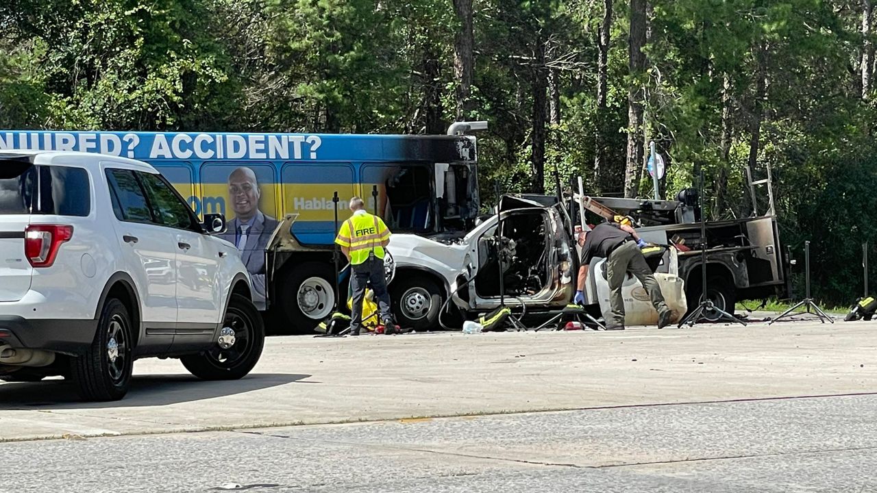 FHP removed the barrier surrounding the crash scene, revealing the wreckage of a Volusia County utility truck that slammed into a county bus, sparking a fire in the back. (Spectrum News/Nicole Griffin)