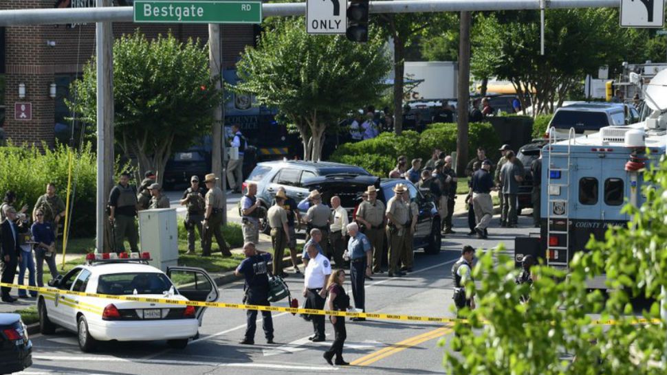 Police secure the scene of a shooting at an office building housing The Capital Gazette newspaper in Annapolis, Md., Thursday, June 28, 2018. (AP Photo/Susan Walsh)