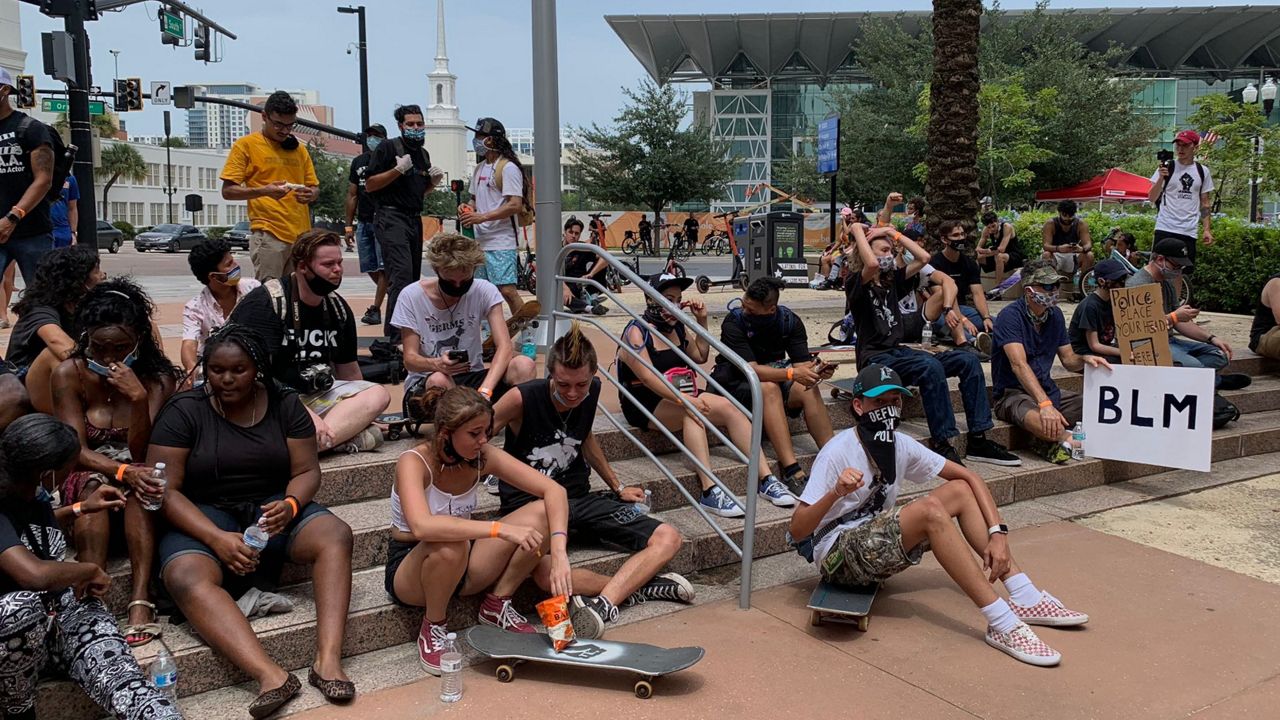 Dozens of people gathered in downtown Orlando on Sunday for the Black Artists for Black Lives March. (Emily Braun/Spectrum News 13)