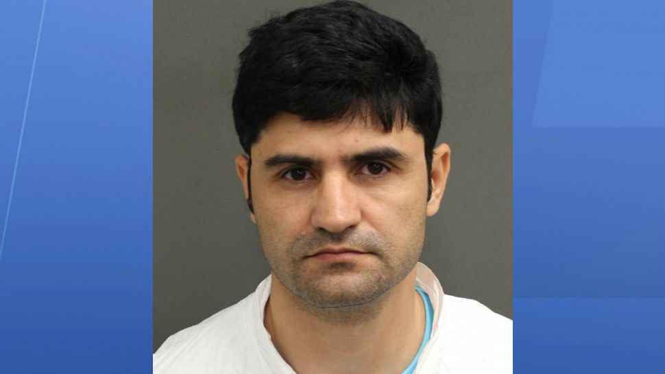 Ali Borji, 39, is charged with stalking after a student told authorities the UCF professor continuously contacted her for more than a year. (UCF Police)