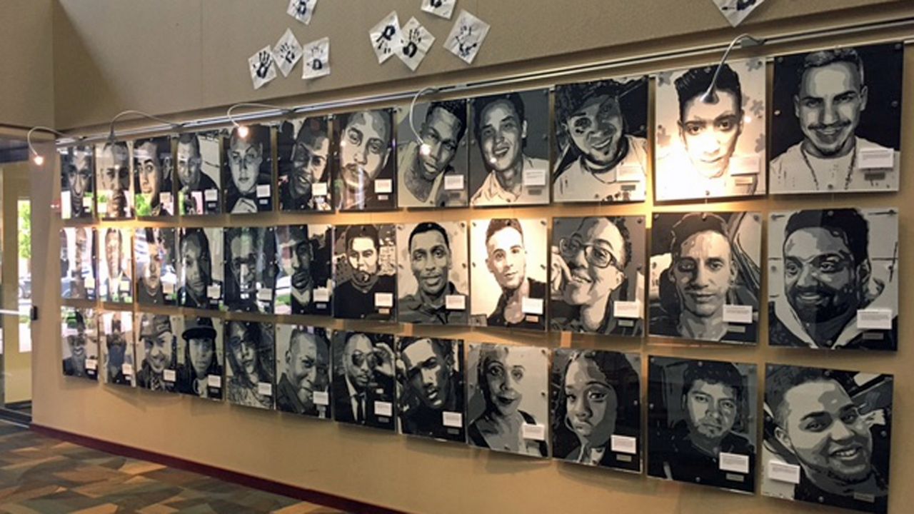 Volunteers took down the Orlando Traveling Memorial, which had been on display in the lobby of the Orange County Government building since the two-year anniversary of the Pulse shooting. (Jeff Allen, staff)