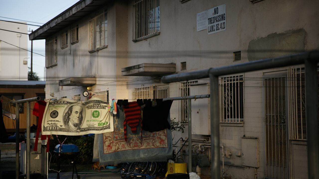 Laundry hangs on a clothesline outside an apartment building at the Jordan Downs housing project in the Watts neighborhood of Los Angeles, Monday, June 15, 2020. (AP Photo/Jae C. Hong)