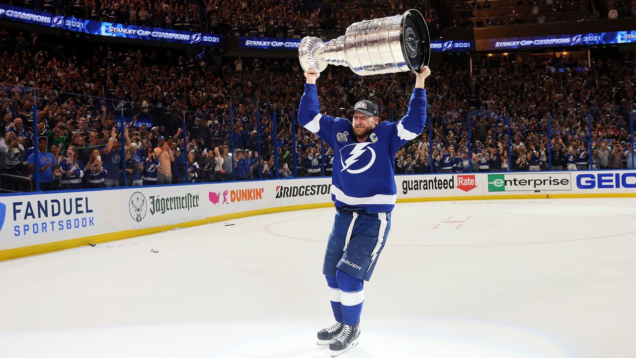 Tampa Bay Lightning's Steven Stamkos hoists the Stanley Cup after the team's 1-0 victory against the Montreal Canadiens in Game 5 of the NHL hockey Stanley Cup Finals, Wednesday, July 7, 2021, in Tampa, Fla. (Bruce Bennett/Pool Photo via AP)