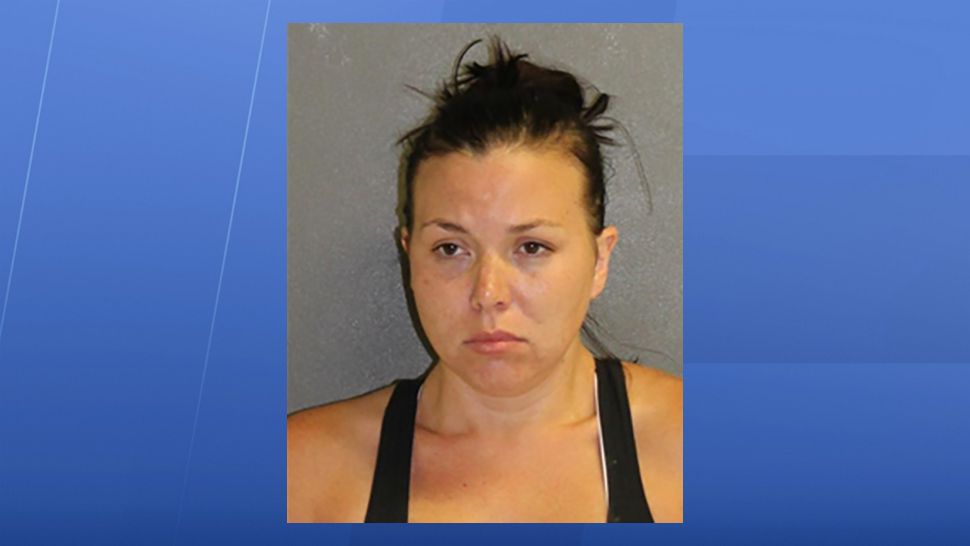 Meagan Burgess, 33, is accused of forgetting a baby in an SUV and has been charged with child neglect. (Volusia County Sheriff's Office)