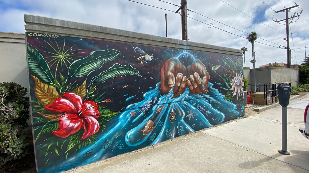 A mural by Clinton Bopp is one of 10 kicking off the Redondo Walls mural project. (Spectrum News/David Mendez)