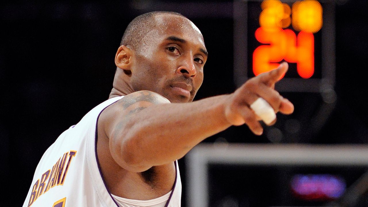 In this June 7, 2009, file photo, Kobe Bryant points to a player behind him after making a basket in the closing seconds against the Orlando Magic in the NBA basketball finals, in Los Angeles. (AP Photo/Mark J. Terrill)