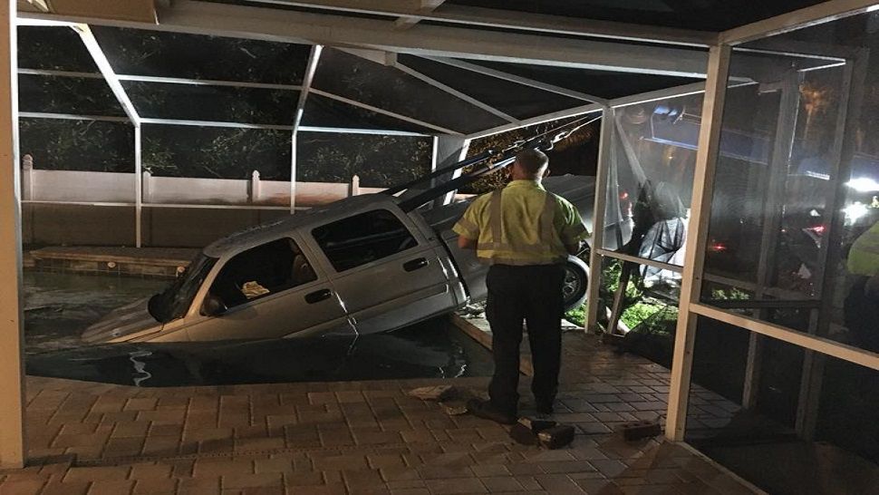 Pickup truck plunges into pool