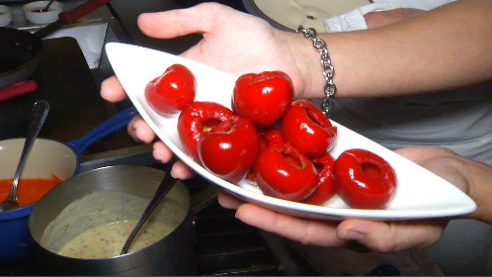 These are peppadew peppers that get reduced into a rich, red sauce that you can drizzle over scallops and grits.