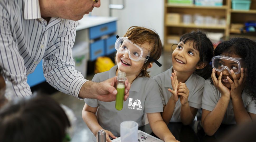 Students interacting side of International Academy of San Antonio classroom (Courtesy: International Academy of San Antonio)