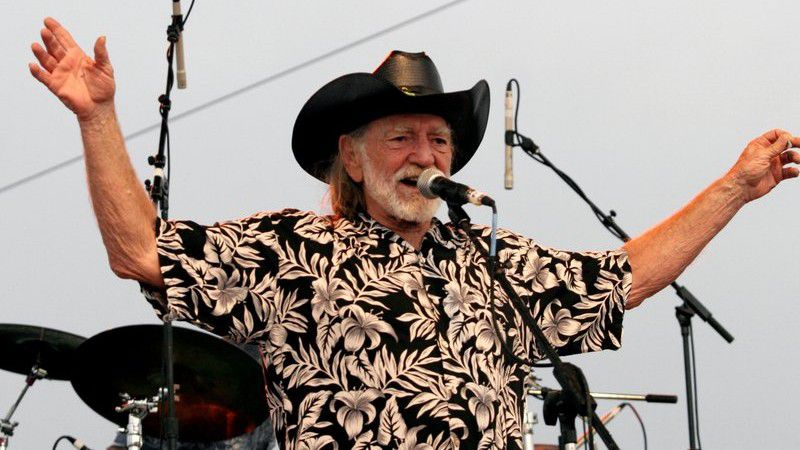 FILE - In this July 4, 2006, file photo, Willie Nelson addresses fans attending his Fourth of July Picnic in Ft. Worth, Texas. Willie Nelson’s annual Fourth of July Picnic is going ahead this year, but to reduce concerns about the coronavirus the event will be virtual. Fans can tune in to the nearly 50-year-old music bash Saturday via livestream. (AP Photo/Rex C. Curry, File)